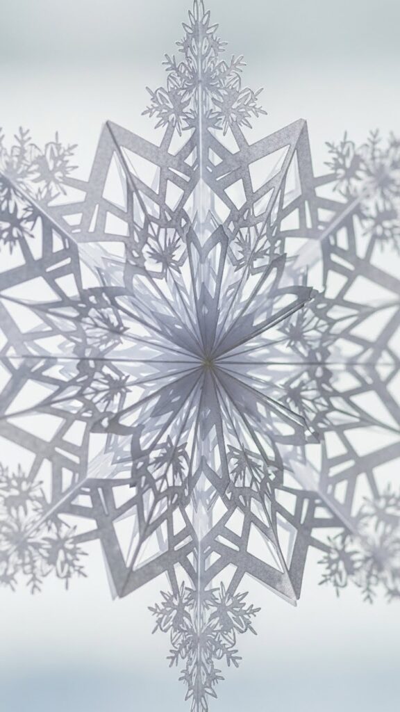 Detailed snowflake paper cut designs