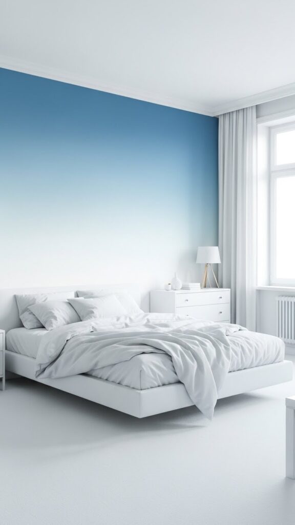Ice blue ombre gradient wallpaper fading to white in serene minimalist bedroom