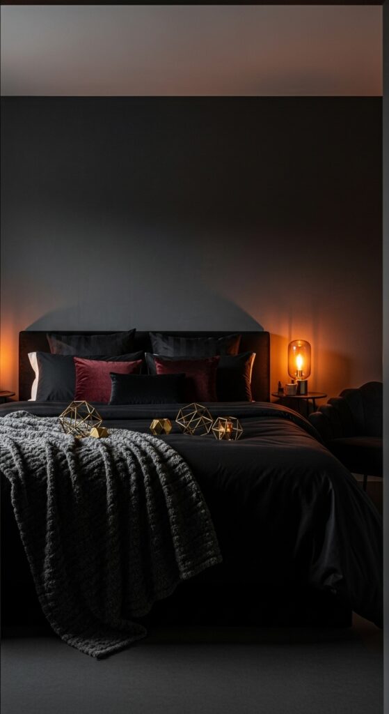 Moody dark bedroom with charcoal walls, black bedding, and warm brass lighting