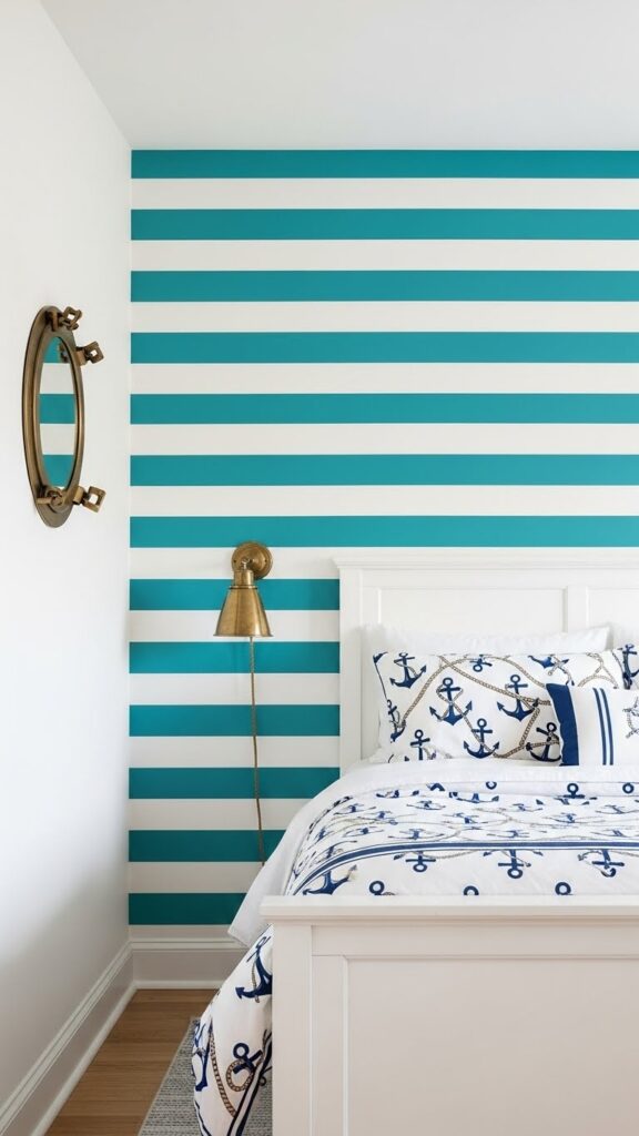 Teal and white horizontal striped nautical accent wall in coastal bedroom