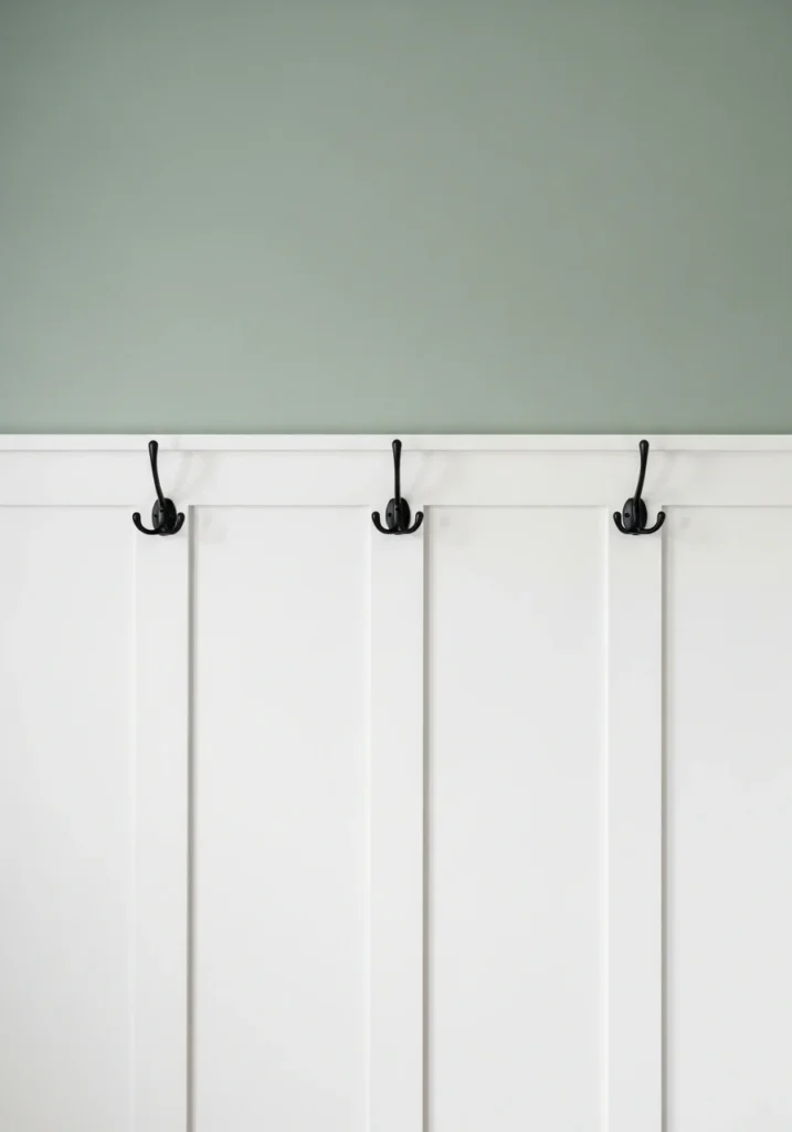 White wainscoting wall treatment in traditional entryway