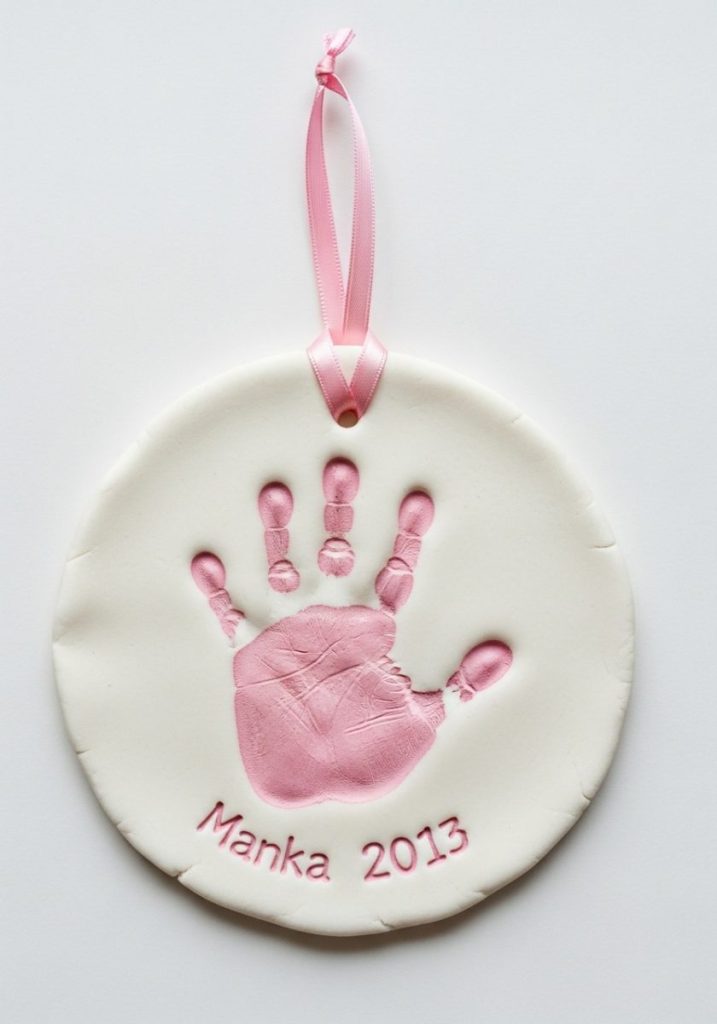 Salt dough handprint keepsake mothers day craft kids flat round white salt dough disc small child handprint pressed centre painted soft pink name year written ribbon hanging precious timeless beautiful gift