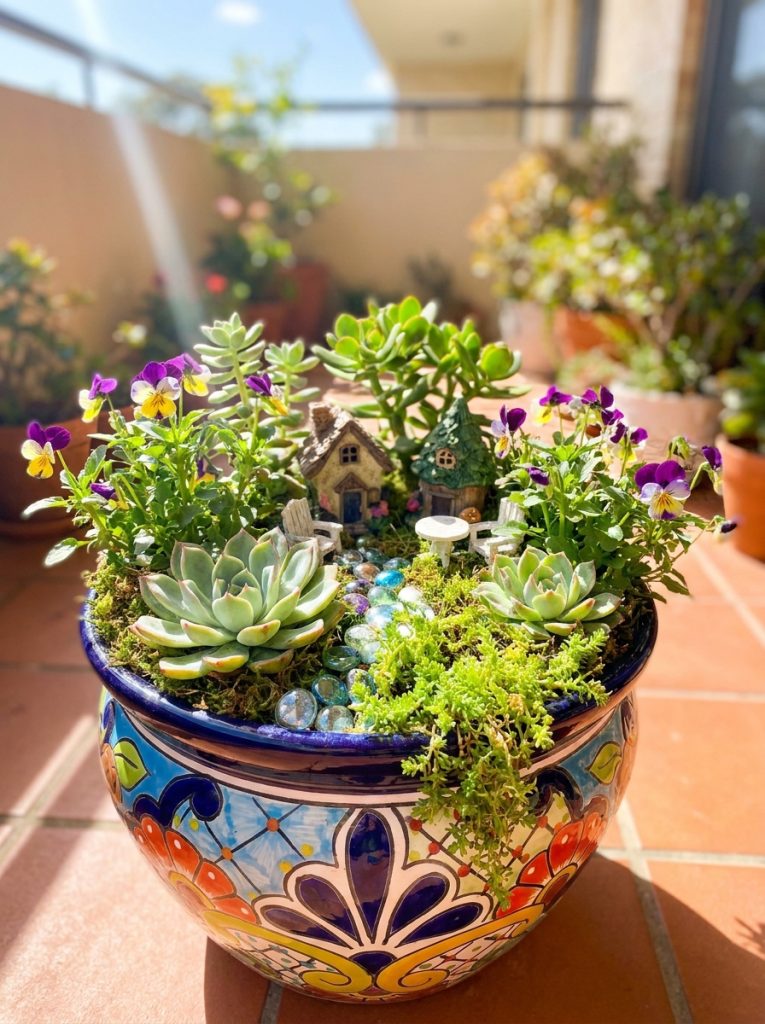  Beautiful fairy garden in large colorful ceramic planter pot with succulents flowers and miniature accessories