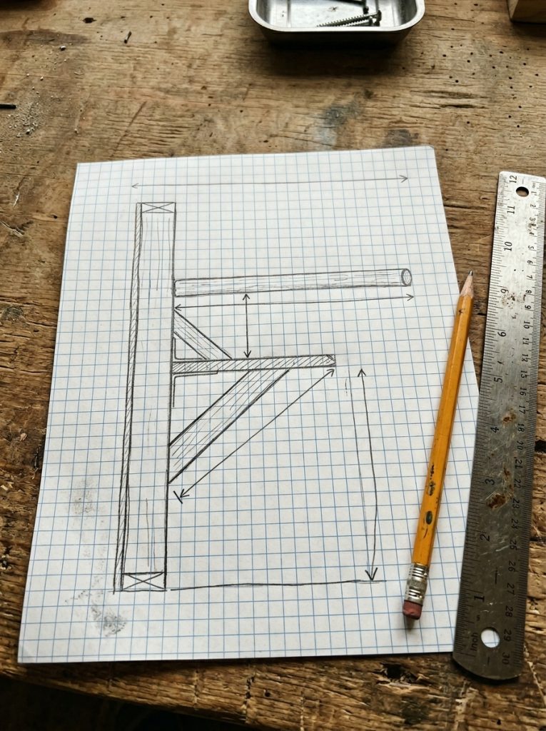 Handwritten DIY poop shelf plans with measurements for chicken coop roosting setup