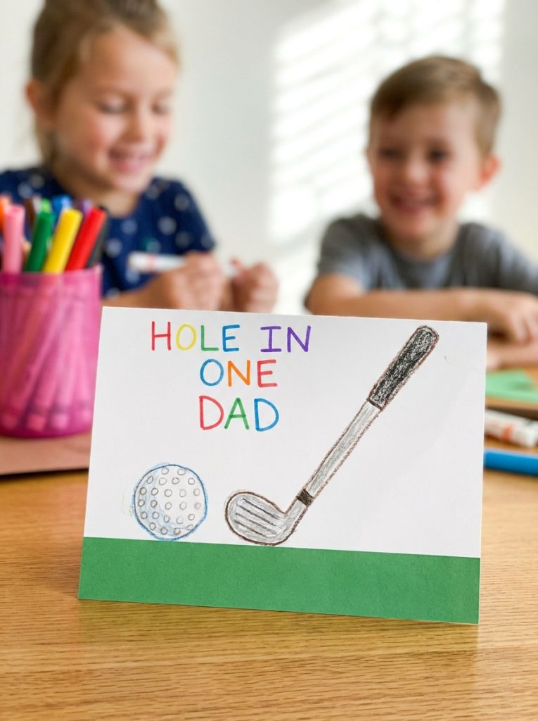 Creative golf themed fathers day card with golf ball club and hole in one dad message