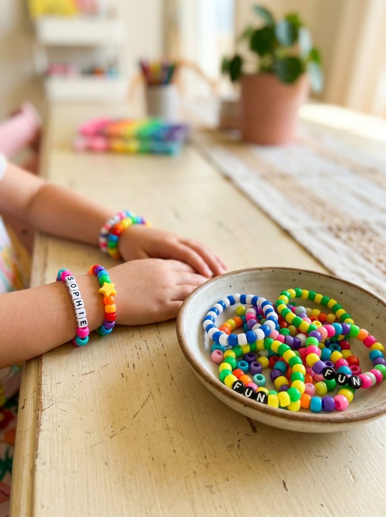 Fun colorful pony bead bracelet ideas made by kids with bright letter and pattern designs in cheerful homemade collection