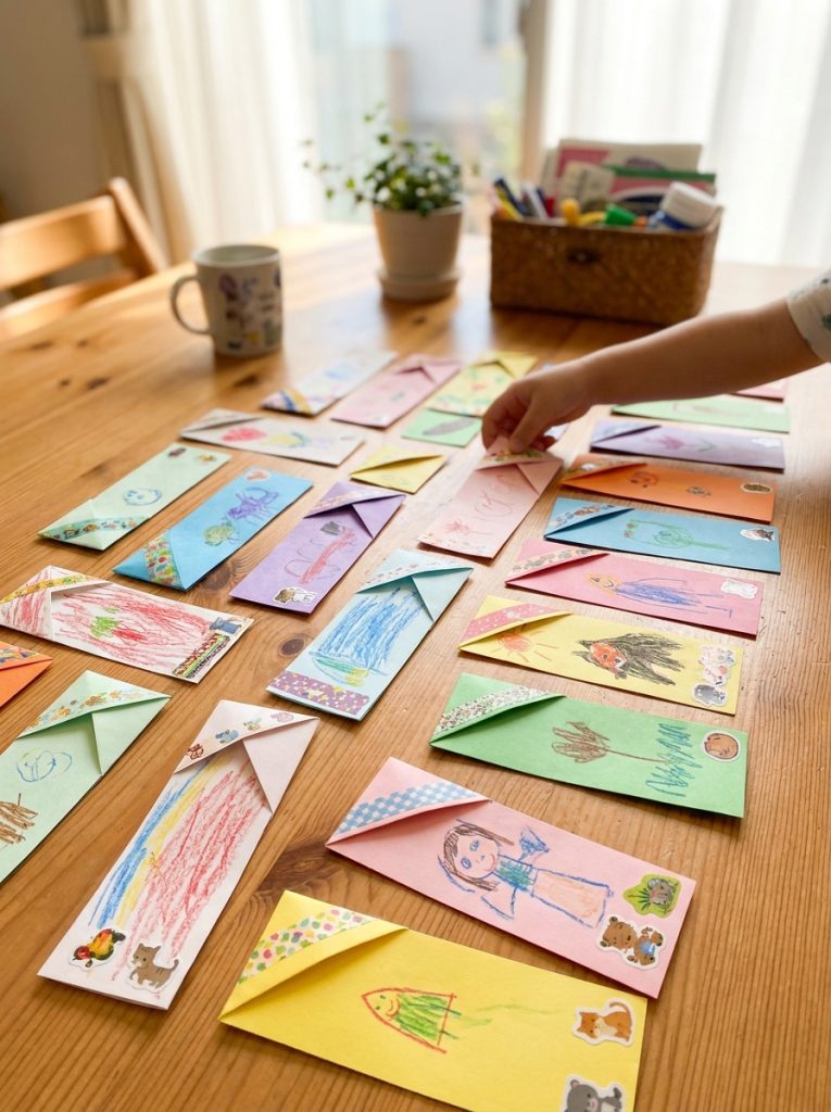 Adorable easy paper bookmark crafts with colorful folded corner designs decorated with drawings and stickers in bright display