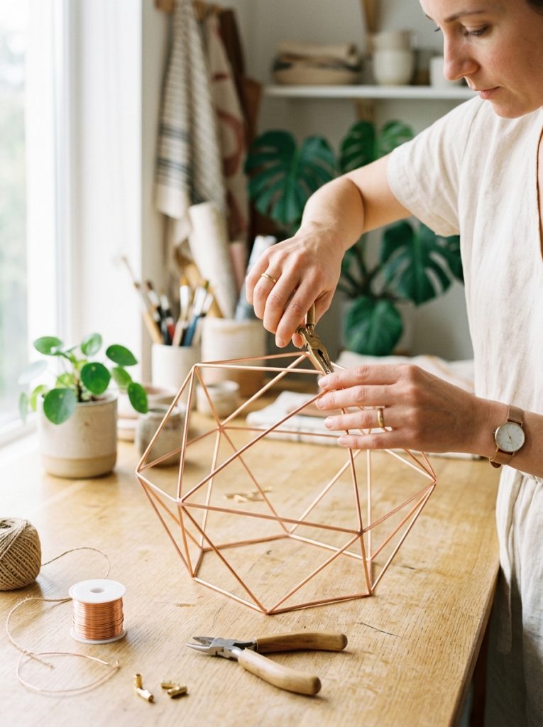 DIY wire frame lamp shade with clean geometric lines in natural wire finish on bright work surface